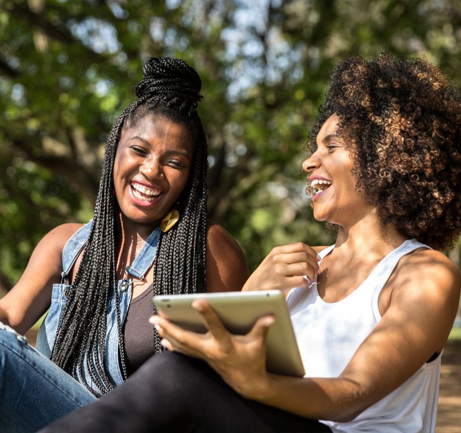 two students smiling and laughing